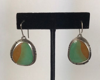 Turquoise and silver earrings.