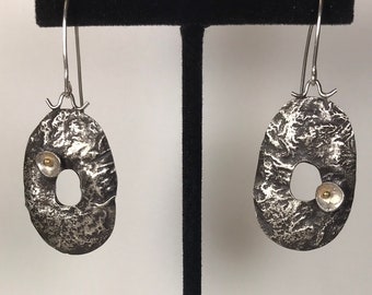 SOLD.                             Reticulated silver with.gold earrings.