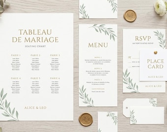 Può includere: Un set di cancelleria per matrimoni con tableau de mariage, menu, carta RSVP e segnaposto con testo dorato e illustrazioni di foglie verdi. Il set include due sigilli in ceralacca dorata ed è decorato con ranuncoli bianchi ed eucalipto.