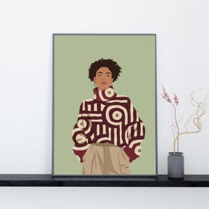 Puede incluir: Una ilustración digital enmarcada de una persona con cabello oscuro rizado que viste un suéter de cuello alto con un patrón geométrico en granate y crema. La persona lleva pendientes de aro dorados y pantalones color beige sobre un fondo verde salvia.