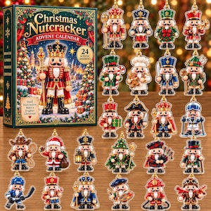 May include: A Christmas Nutcracker advent calendar box featuring 24 acrylic ornaments. The box displays a nutcracker illustration and the text Christmas Nutcracker Advent Calendar. The 24 individual nutcracker ornaments depict various characters including a king, chef, skier, and musician in colorful uniforms.