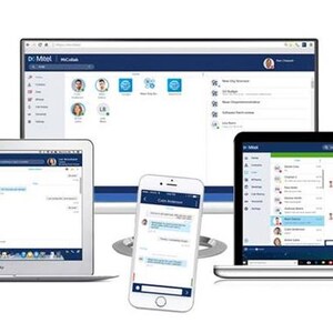 May include: A desktop computer monitor, two laptops, and a smartphone displaying the Mitel MiCollab software interface. The screens show blue and white navigation menus, contact lists, and chat windows with user profile icons and text.