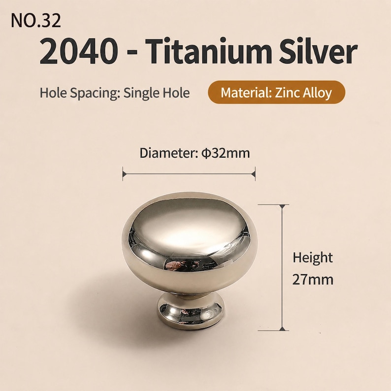 May include: A titanium silver cabinet knob made of zinc alloy with a single hole mounting. The knob features a smooth, rounded top with a diameter of 32mm and a height of 27mm. Text on the image includes NO.32, 2040 - Titanium Silver, Hole Spacing: Single Hole, Material: Zinc Alloy, Diameter: 32mm, and Height: 27mm.