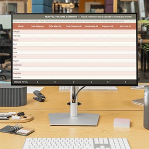 May include: A computer monitor displaying a Monthly Income Summary spreadsheet template with columns for Total Sessions, Total Billed, Total Collected, Outstanding, Expenses, and Net Profit, featuring rows for each month from January to December.