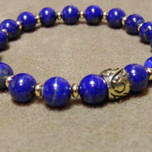 Intense Blue Lapis Lazuli with Gold Plated Heishi Spacers and an Antique Gold Bali Bead Stretch Bracelet
