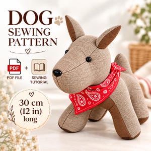 May include: A dog sewing pattern featuring a PDF file and sewing tutorial. The finished plush dog is 30 cm (12 in) long, made of tan textured fabric with brown accents, black bead eyes, a black nose, and a red bandana with a white paisley print.
