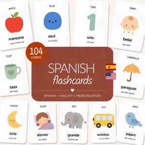 May include: A set of 104 educational flashcards featuring Spanish and English vocabulary with pronunciation guides. Each card displays a colourful illustration of items like an apple, cup, moon, or elephant, accompanied by the corresponding word in both languages.