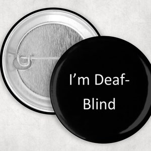 Puede incluir: Botón negro y blanco con el texto "I'm Deaf-Blind" en blanco.