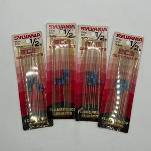 May include: Four packages of Sylvania ECG flameproof resistors, each containing five 1/2 watt, 1K ohm, 2% tolerance resistors. The packaging is red and white with clear plastic fronts, displaying the Sylvania and ECG Components branding.