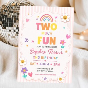 May include: A rectangular birthday invitation card with a light pink striped background. The center features a scalloped white frame with a rainbow, flowers, hearts, and stars. Text reads: TWO MUCH FUN, JOIN US TO CELEBRATE Sophia Rose's 2ND BIRTHDAY.