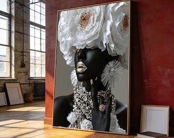 May include: A framed wall art print featuring a portrait of a person with dark skin, wearing a large white floral headpiece, metallic gold lipstick, and elaborate silver jewelry including a statement necklace, large sunburst earrings, and rings.
