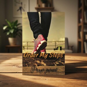 May include: A rectangular prayer journal featuring a graphic of legs in dark jeans and pink athletic sneakers walking on a stone path. The cover displays the text Order My Steps in orange and Prayer journal in black script font.