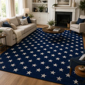 May include: A large rectangular area rug featuring a deep navy blue background covered in a repeating pattern of small, light-colored five-pointed stars arranged in a uniform grid across the entire surface of the floor covering.