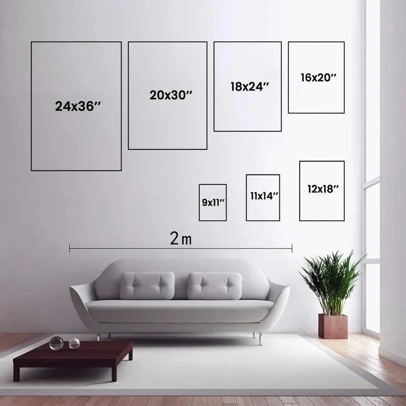 May include: A wall display showing seven rectangular frames in various sizes labeled 24x36", 20x30", 18x24", 16x20", 12x18", 11x14", and 9x11" inches. A horizontal line indicates a 2m width above a light gray sofa and a small potted plant.