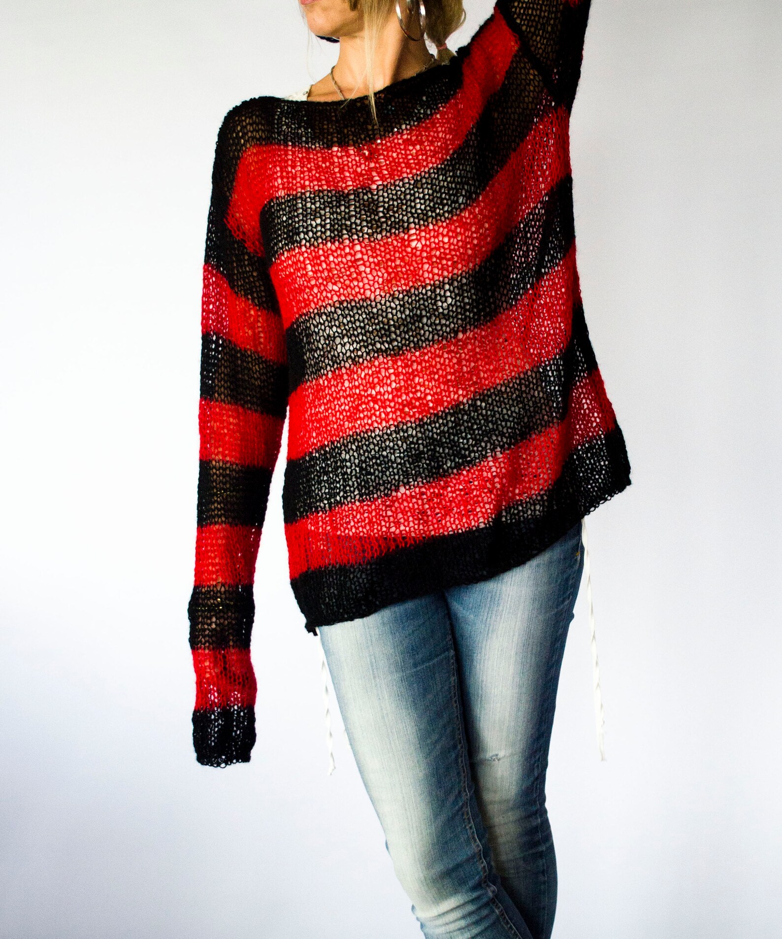 black jumper with red stripe down sleeve