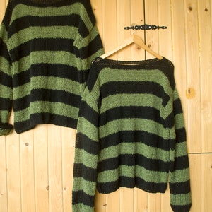 Unisex striped knit pullover sweater with moody forest tones, ideal for grunge fashion lovers or streetwear looks with a handmade twist.
