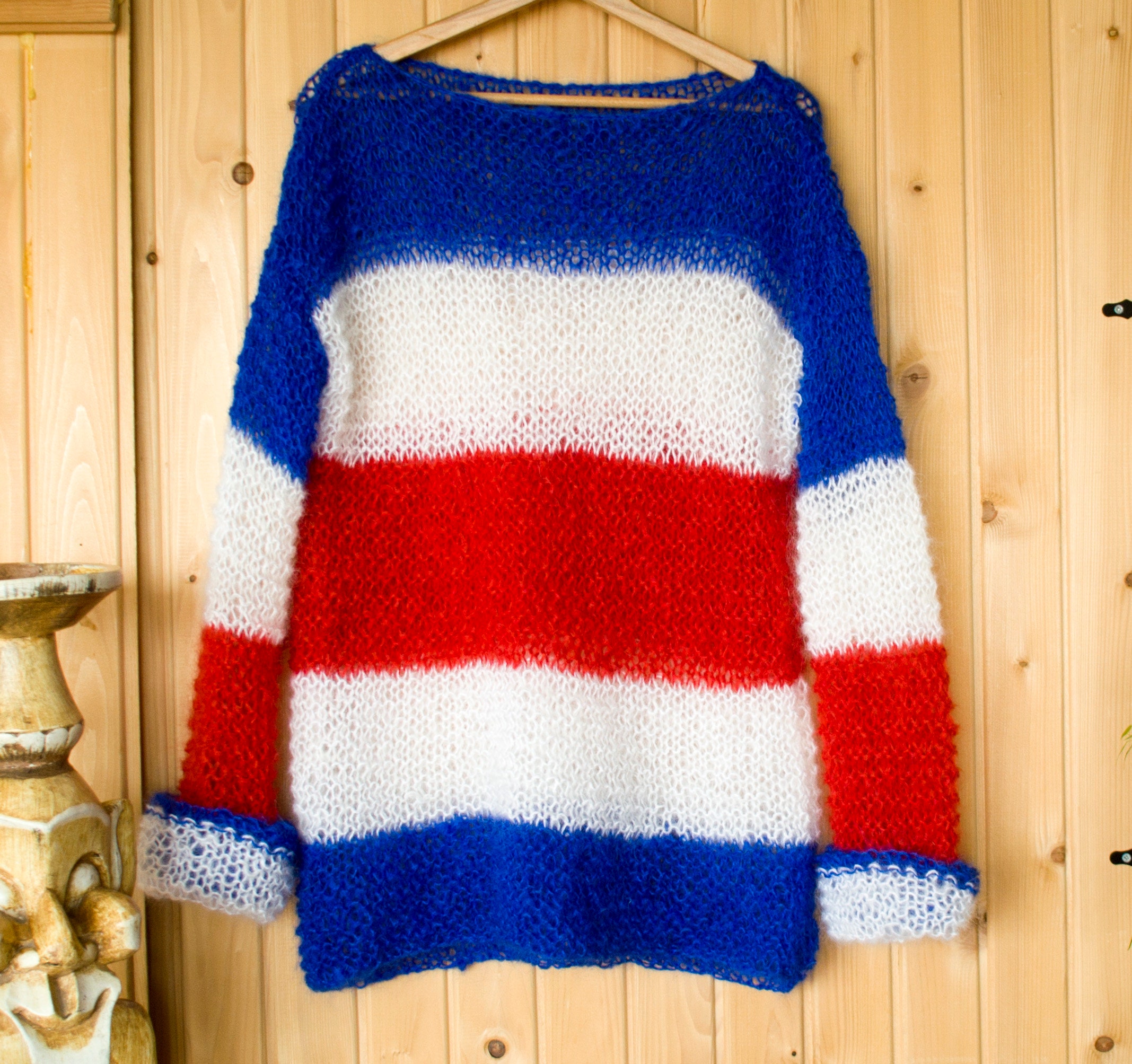 Blue white top and red jumper