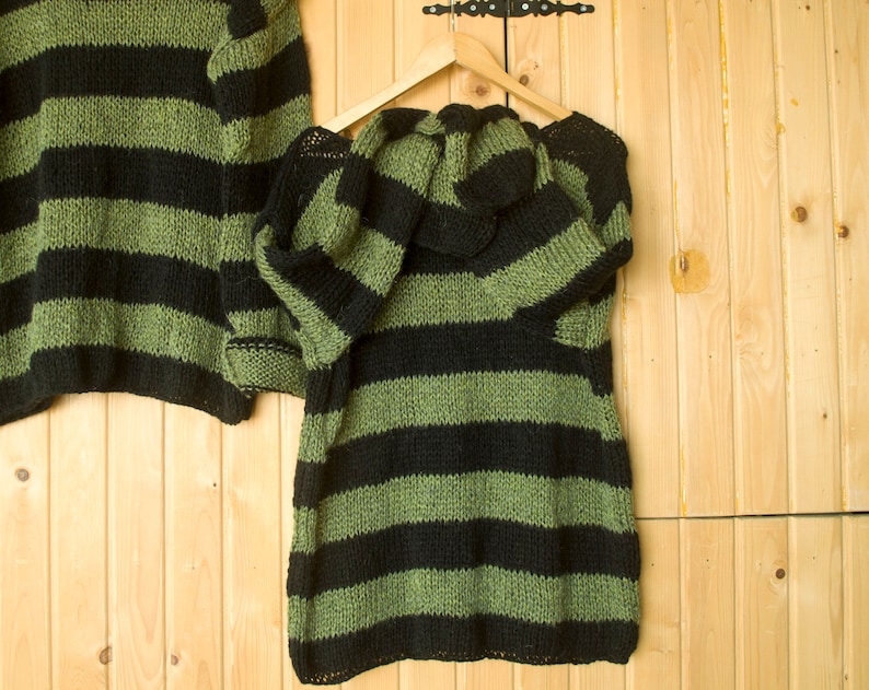 Soft mohair-blend striped sweater in forest green and black, featuring a boxy cut and relaxed silhouette for fall and winter styling.