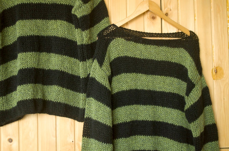 Cozy mohair sweater with thick black and green stripes, hand-knit for a soft feel and breathable design—perfect for layering in colder seasons.