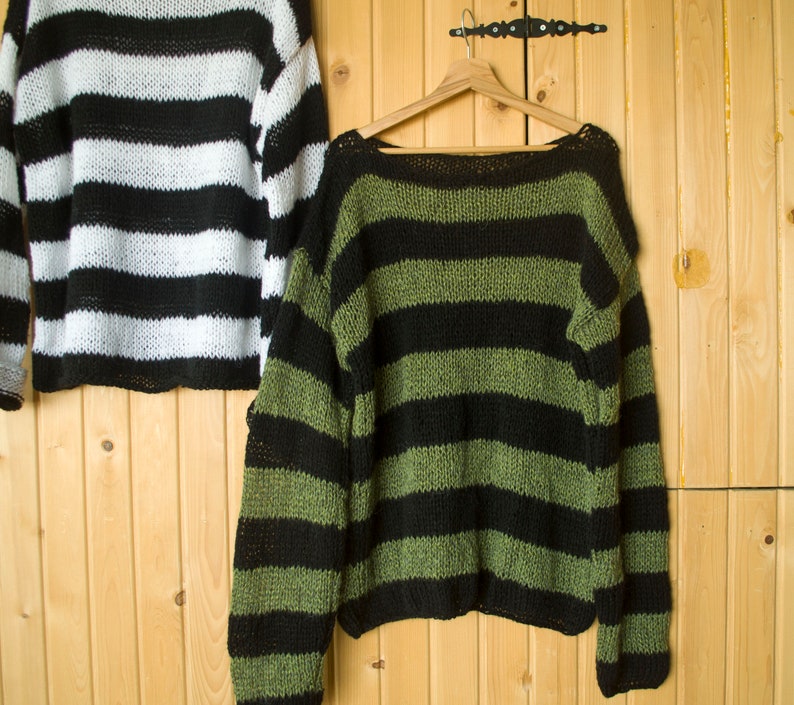 Black and green horizontal striped sweater, oversized fit with dropped shoulders, made for punk, goth, or alternative outfit layering.