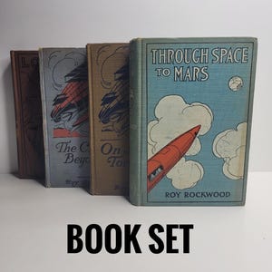 May include: A set of three ceramic mugs with a speckled, matte finish. Each mug features a different color: light blue, cream, and gray. The mugs have a simple, modern design with a rounded shape and a handle.