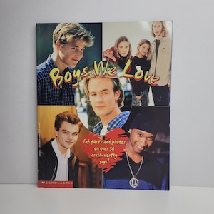 May include: A book cover with the title "Boys We Love" in a colorful font. The cover features photos of young men, including Leonardo DiCaprio, and the text "Fab facts and photos on over 30 crush-worthy guys!"