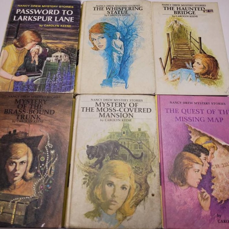 May include: A collection of six vintage Nancy Drew mystery books. The book covers feature illustrations of the main character and scenes from the stories. Titles include "Password to Larkspur Lane" and "The Whispering Statue."