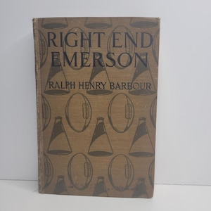 May include: A brown book with the title "Right End Emerson" by Ralph Henry Barbour. The cover features a repeating pattern of footballs and megaphones.
