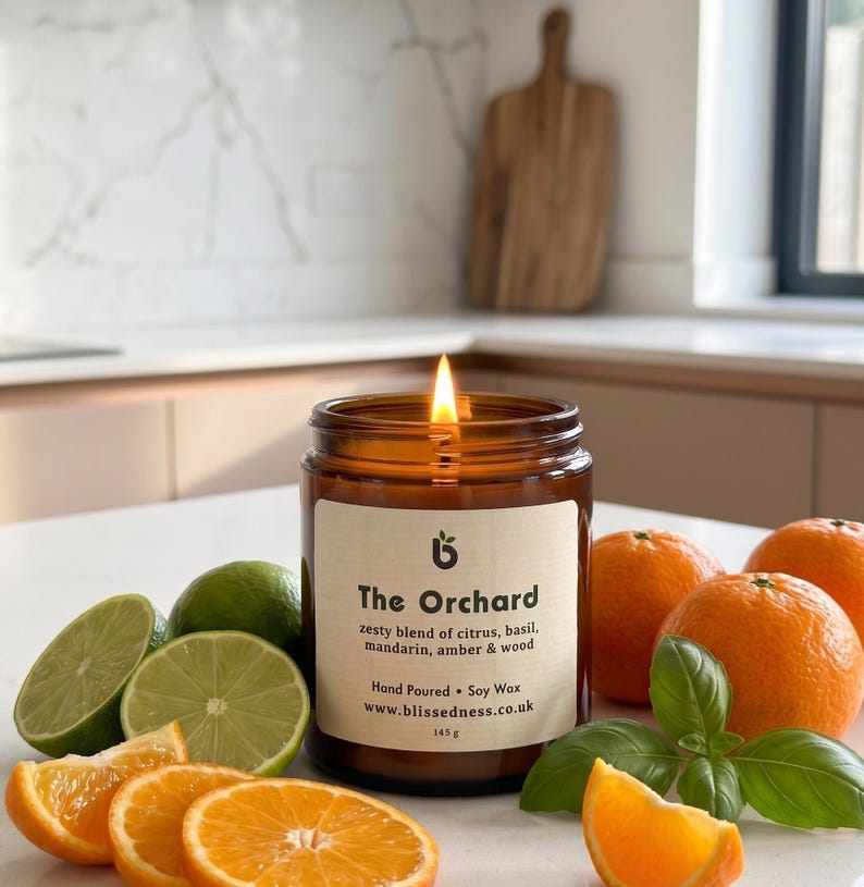 The Orchard citrus candle in amber glass jar
