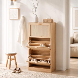May include: A tall, light-toned wooden shoe cabinet featuring a top storage compartment with a textured panel and two lower pull-out drawers with white metal hinges. The cabinet is open, revealing internal shelves holding several pairs of shoes.