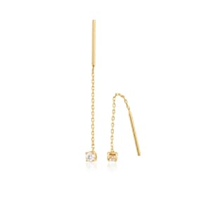 May include: A pair of gold threader earrings, each featuring a delicate chain attached to a straight post at one end and a single, small, round, clear faceted gemstone set in a gold bezel at the other end, creating a long, dangling design.