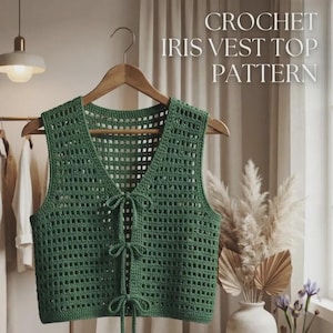 May include: A green crochet vest top with a V-neckline and three front tie closures. The garment features a square grid pattern and is displayed on a wooden hanger. The text CROCHET IRIS VEST TOP PATTERN is visible in the upper right corner.