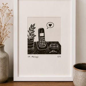 May include: A black and white linocut print in a white frame depicting a cordless telephone on a base, a potted plant, an ashtray, and keys. A speech bubble with a heart icon floats above the phone. The text 04. Mensaje and 1/15 is printed below.