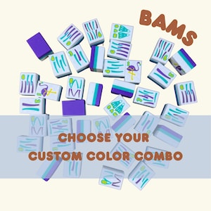 May include: A collection of white, purple, and teal Mahjong tiles with various symbols and designs. The text "BAMS" is at the top, and "CHOOSE YOUR CUSTOM COLOR COMBO" is at the bottom. The tiles are scattered across a light beige background.