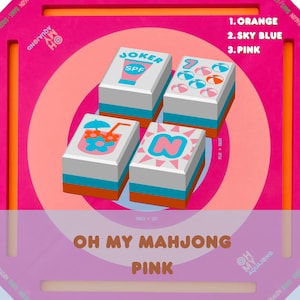 May include: A pink and orange Mahjong set with four tiles featuring various summer-themed graphics and the text "JOKER" and "SPF". The set includes the text "OH MY MAHJONG PINK" and color options: orange, sky blue, and pink.