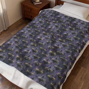 May include: A rectangular throw blanket featuring a repeating pattern of black chandeliers with glowing yellow lights against a dark purple, textured background. The blanket is spread out over a bed with a white pillow and a wooden nightstand.
