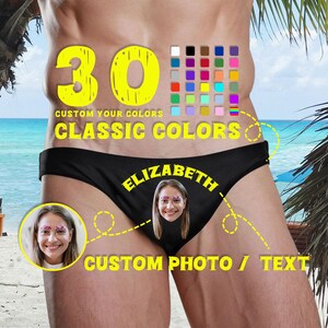 Könnte beinhalten: Schwarze Badehose mit einem personalisierten Foto eines Gesichts und dem Namen ELIZABETH in gelber Schrift. Das Design enthält ein Raster mit 30 Farbfeldern, den Text 30 CUSTOM YOUR COLORS CLASSIC COLORS und CUSTOM PHOTO / TEXT.