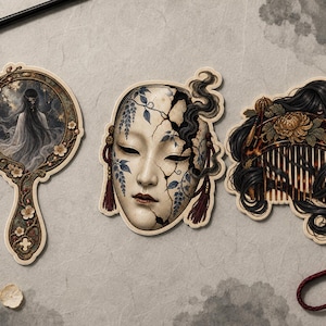 May include: Three decorative stickers featuring a hand mirror with a figure in a starry scene, a cracked face mask adorned with blue floral vines and red tassels, and a hair comb nestled within dark flowing hair and a large golden flower.