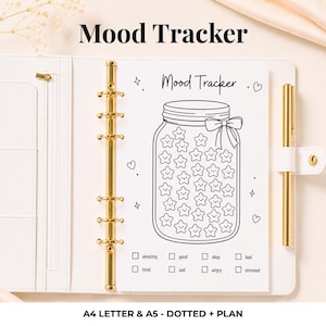 May include: A white planner binder with gold rings and a gold pen, containing a mood tracker insert. The page features a large jar illustration filled with star shapes, a bow, and text reading Mood Tracker, amazing, good, okay, bad, tired, sad, angry, stressed.