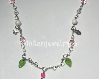 handmade pink and white necklace with green accents