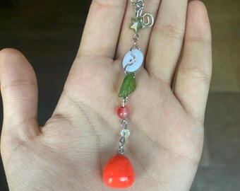 handmade clay strawberry keychain with white and green beads