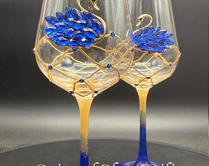 Dark blue swan toasting wine glasses