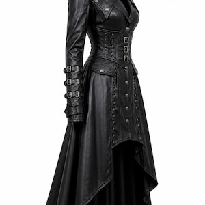 May include: A black long-sleeved coat featuring a high-low hemline, a structured collar, and a fitted bodice with front button closures. The sleeves include three buckled straps, while the waist area displays decorative lacing and metal hardware.