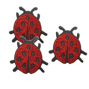 May include: Three embroidered ladybug patches featuring a vibrant red body with black spots and black outlines. Each patch depicts the insect with six legs and two antennae, showcasing detailed stitching that creates a textured appearance.