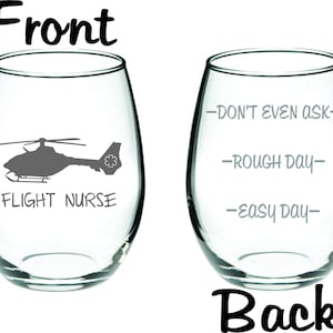May include: A clear glass wine glass with a black silhouette of a helicopter and the text "Flight Nurse" on the front. The back of the glass has the text "Don't even ask - Rough day - Easy day".