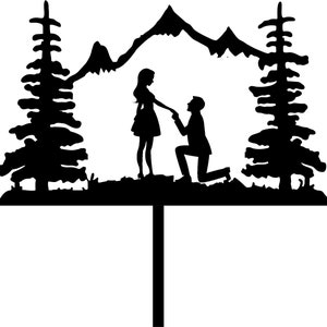 May include: Silhouette of a couple in a mountain setting. The man is kneeling and the woman is standing with her hand on his shoulder. The couple is surrounded by trees.
