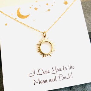 May include: Gold necklace with a sun pendant and a card that says "I Love You to the Moon and Back!"