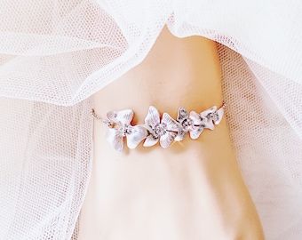 Armband met wilde orchideebloem: goudkleurig bruidscadeau