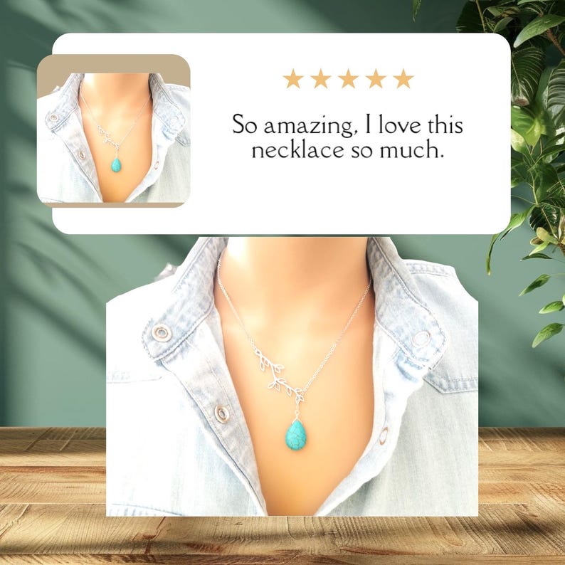 May include: A silver necklace with a turquoise teardrop pendant and a delicate branch design. The necklace is worn by a person with a light blue denim shirt.