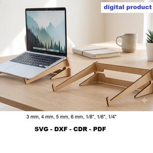 May include: A light-colored wooden laptop stand with a modular design, shown supporting a silver laptop. The text digital product is visible in the corner, along with the specifications 3 mm, 4 mm, 5 mm, 6 mm, 1/8", 1/6", 1/4" and file formats SVG, DXF, CDR, PDF.